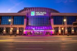 Front of RBC Place London lit in purple light